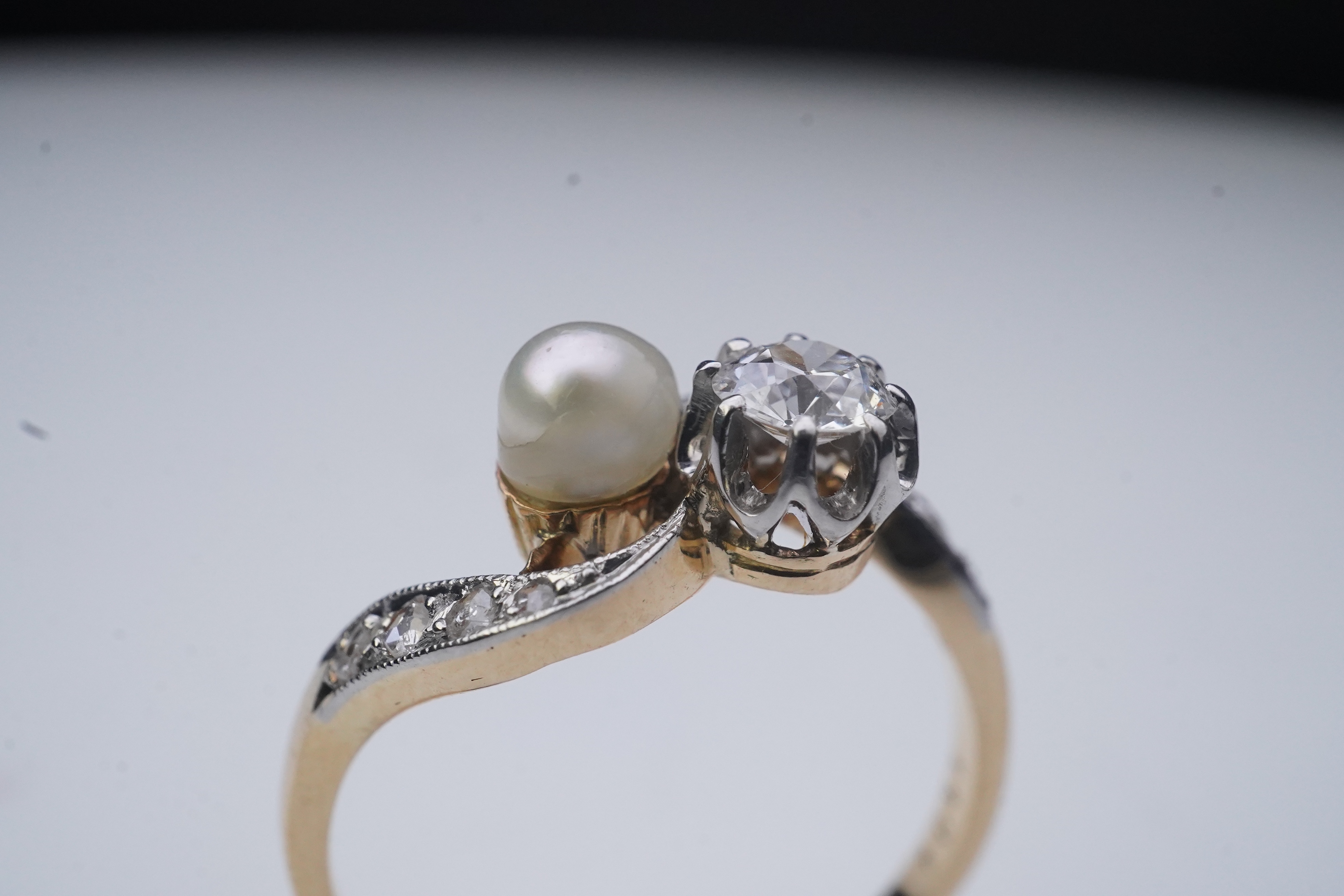 A pearl and diamond toi-et-moi ring, early 20th century